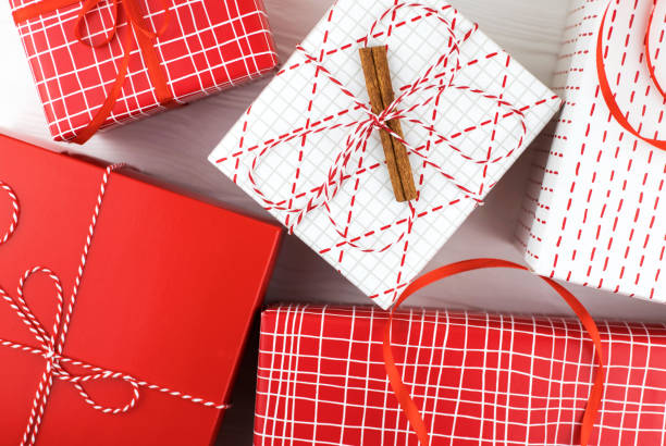 istock Festive gift boxes on wooden white background. 1194094549
