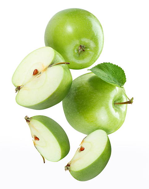 istock Whole and sliced green apples against white background 119409586
