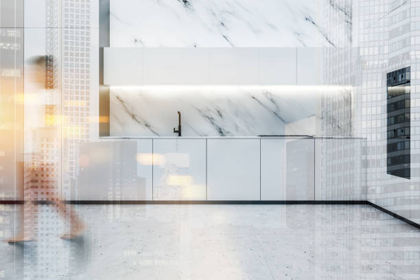 istock Woman walking in luxury white kitchen 1194100816