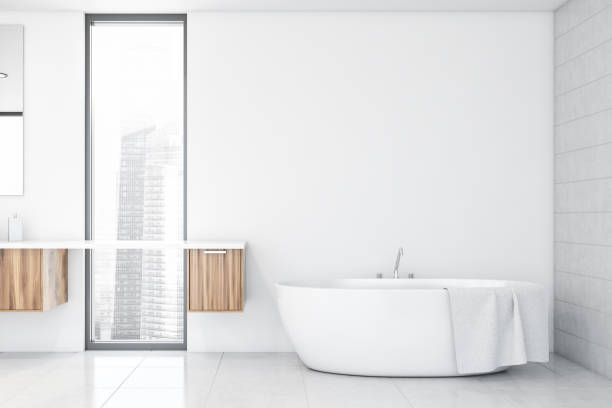 istock White bathroom with tub and shelves 1194101288