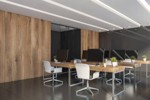 istock Gray and wooden open space office corner 1194102515