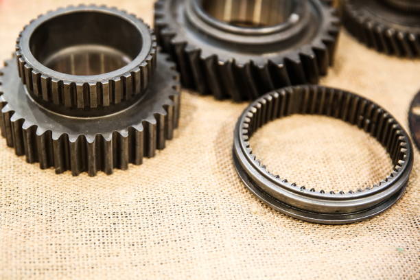istock metal gears on burlap background with copy space 1194104024