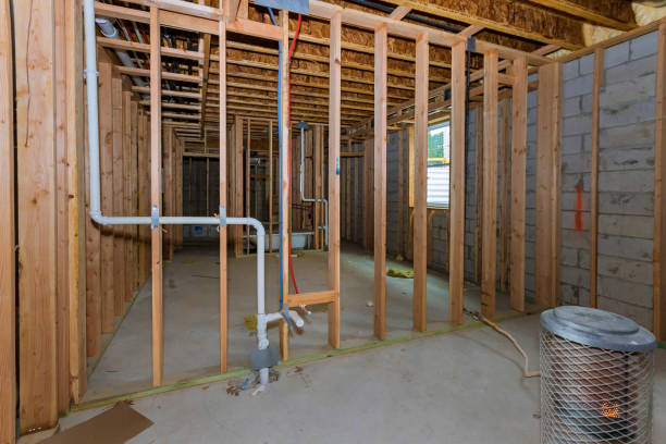 istock Interior stick built frame of a unfinished basement new house under construction 1194105179