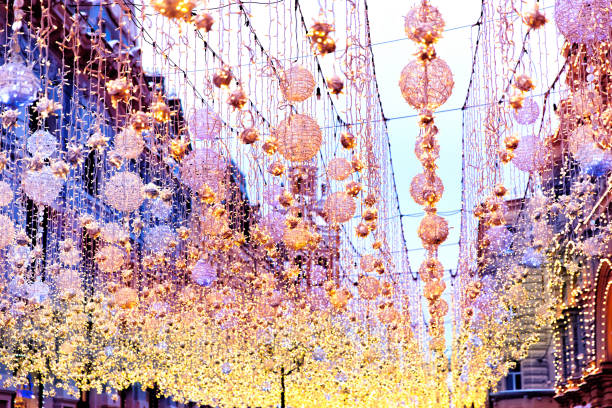 Christmas bright garlands and flashlights on a city stree