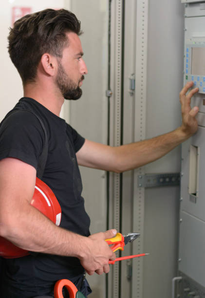 istock Good looking technician operating in power plant 1194107118