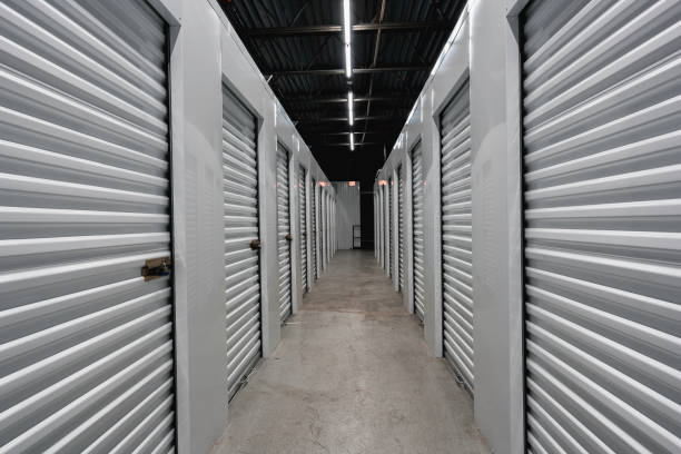 istock Storage warehouse interior. Metal garage doors with locks 1194107553