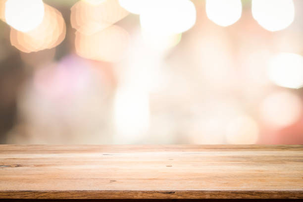 istock Empty wooden table platform and bokeh at night 1194108999