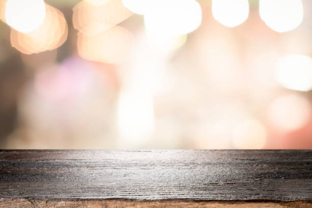 istock Empty wooden table platform and bokeh at night 1194109002