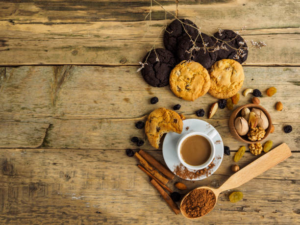 istock Coffee and cookies on a wooden table. Space for text on the table 1194110126