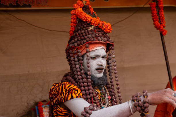 The Kumbh fair of prayagraj Prayagraj, Uttar Pradesh/India - Feb 2019 : Portrait shot of indian naga baba with rudrakh and ask on his body during the holy fair of kumbh prayagraj photos stock pictures, royalty-free photos & images