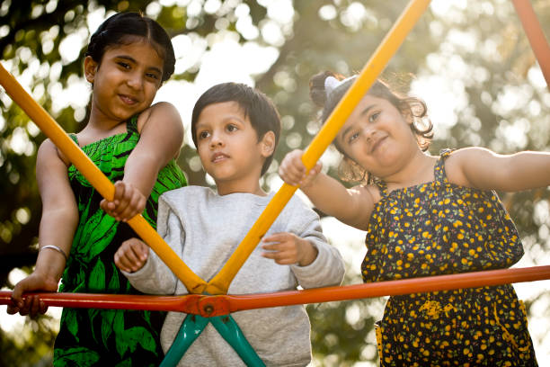 Children standing on amusement park ride