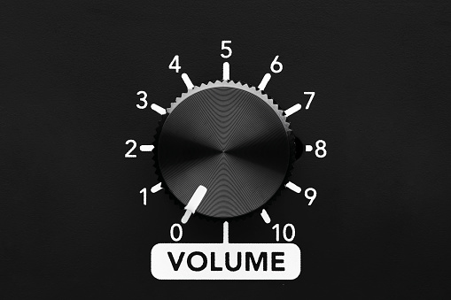Muted volume control knob on zero. Close up view with copy space.