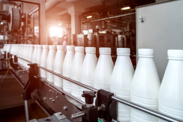 istock White plastic milk bottles on the conveyor on a modern dairy plant 1194114148