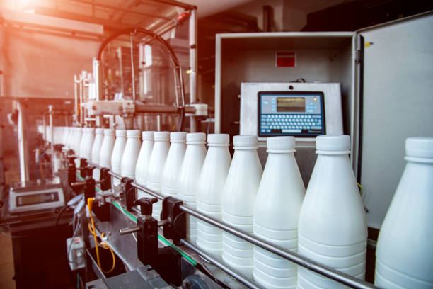 istock White plastic milk bottles on the conveyor on a modern dairy plant 1194114149