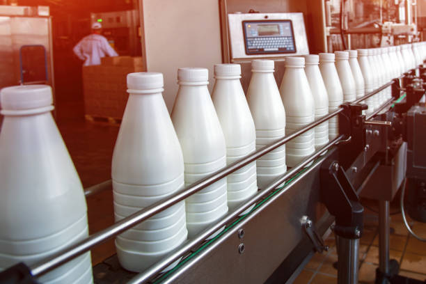 istock White plastic milk bottles on the conveyor on a modern dairy plant 1194114151