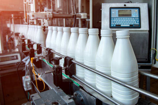 istock White plastic milk bottles on the conveyor on a modern dairy plant 1194114158