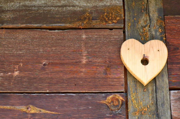 istock Wooden background with a heart 1194115402