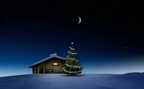 istock Christmas illuminated hut in cold winter night 1194118106