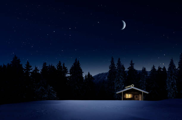 istock Christmas illuminated hut in cold winter night 1194118109
