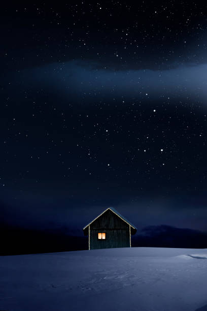 istock Christmas illuminated hut in cold winter night 1194118110