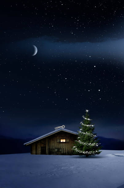 istock Christmas illuminated hut in cold winter night 1194118120