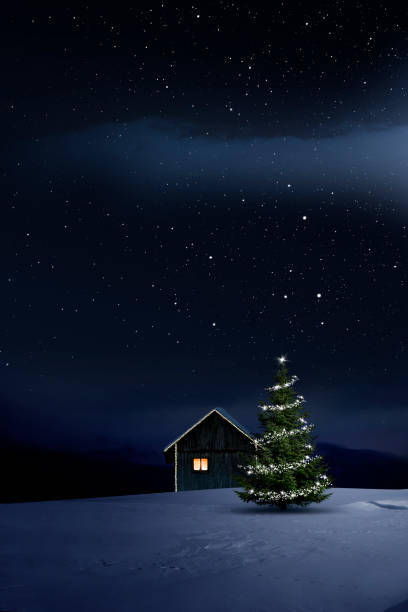 istock Christmas illuminated hut in cold winter night 1194118121