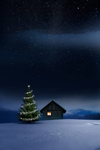 istock Christmas illuminated hut in cold winter night 1194118125