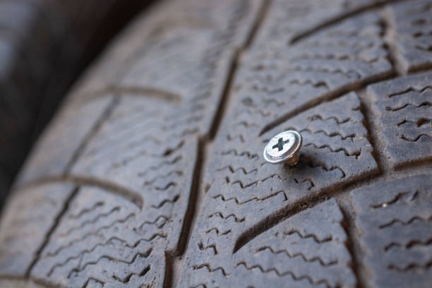 Steel screw in a wheel close-up.