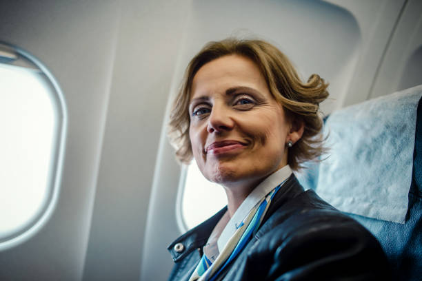 istock Business woman at airplane 1194119507