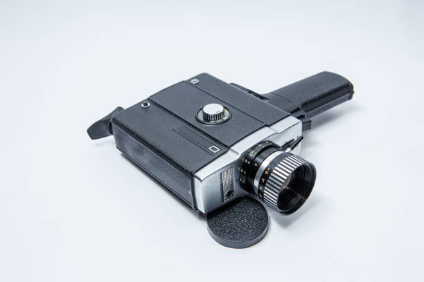 istock Old 8 mm movie camera on a white background 1194121686