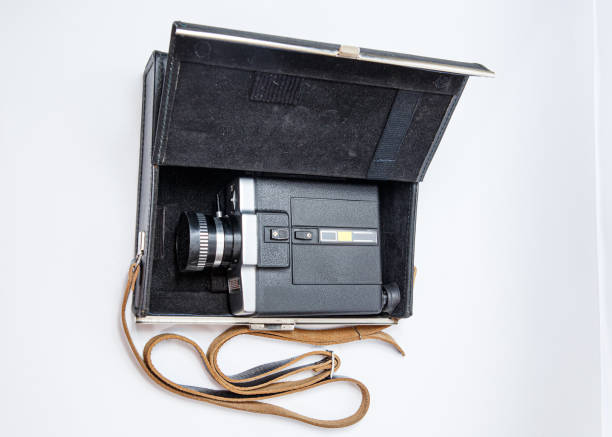 istock Old 8 mm movie camera on a white background 1194121690