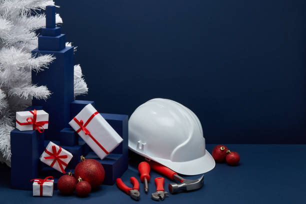 istock Construction tools, hard hat and Christmas decorations. Christmas and New Year construction 1194123115