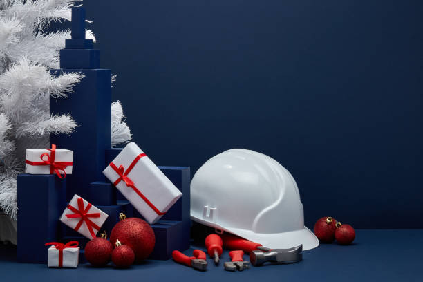 Construction tools, hard hat and Christmas decorations. Christmas and New Year construction