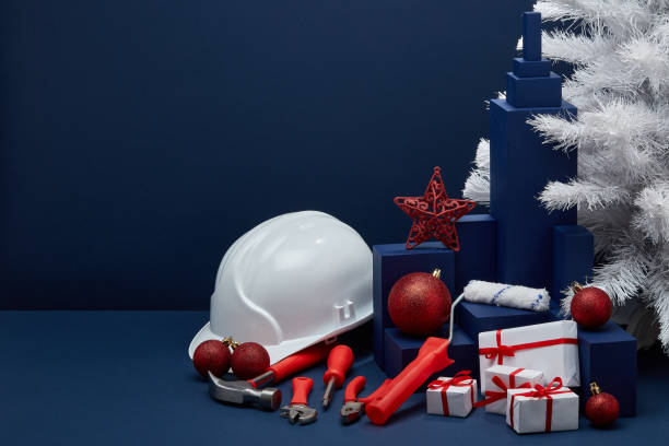 istock Construction tools, hard hat and Christmas decorations. Christmas and New Year construction 1194123190