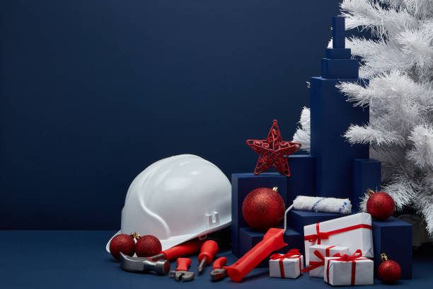 istock Construction tools, hard hat and Christmas decorations. Christmas and New Year construction 1194123204