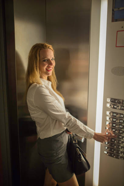 istock Business woman in the elevator 1194123392
