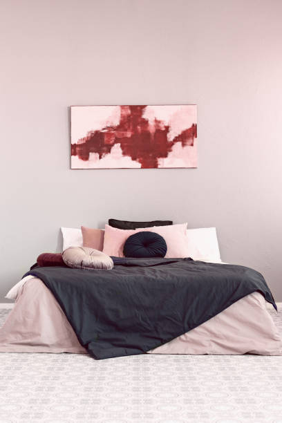 istock Black duvet on king size bed in classy bedroom interior 1194124436