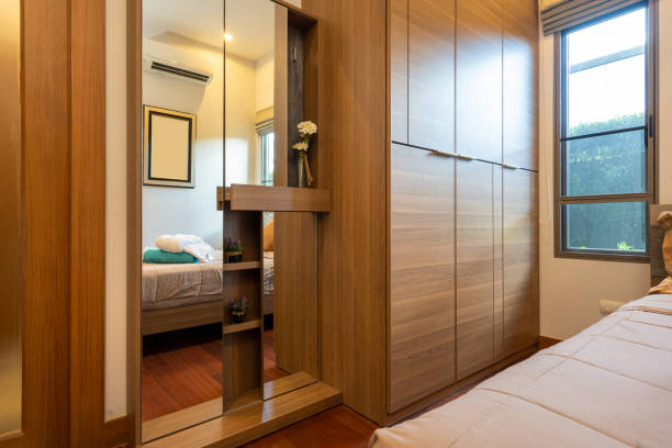 istock Modern bedroom with working desk and bedding 1194125096