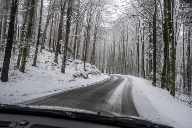 istock Car driving in Snow 1194125649