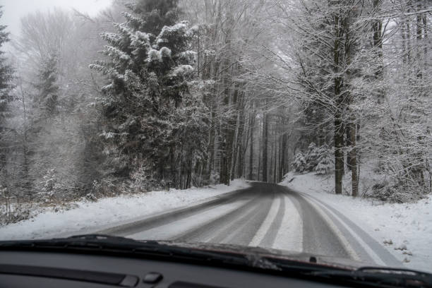 istock Car driving in Snow 1194126207
