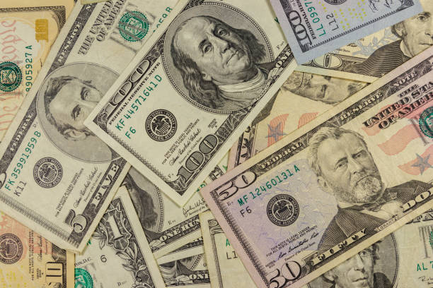 istock Background of different us dollar banknotes 1194127374