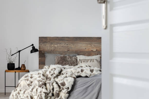 istock Open door to grey elegant bedroom interior with rustic design, copy space on empty wall 1194127476