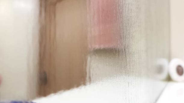 istock Misty wet mirror over a bathroom shelf, perspective view, blurred closeup. 1194128909