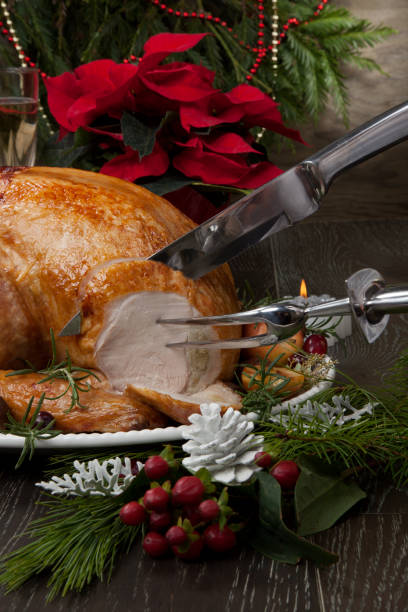 istock Carving Roasted Christmas Turkey with Grab Apples 1194132062
