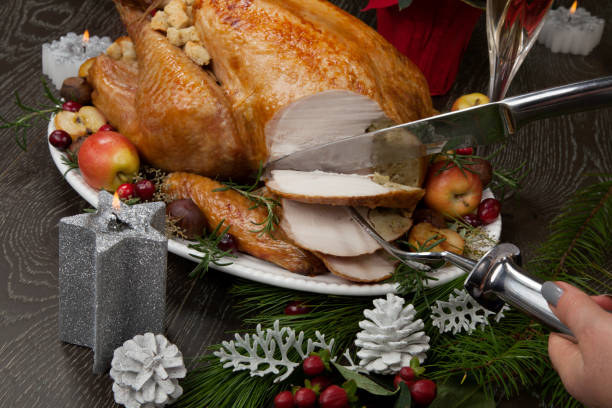 istock Carving Roasted Christmas Turkey with Grab Apples 1194132084