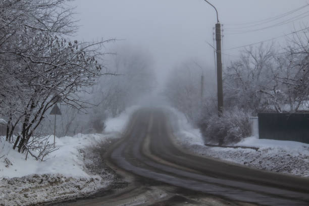 istock A Winter road to the fog 1194134716