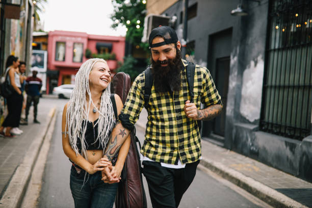 istock Smiling couple walking down the street 1194135265