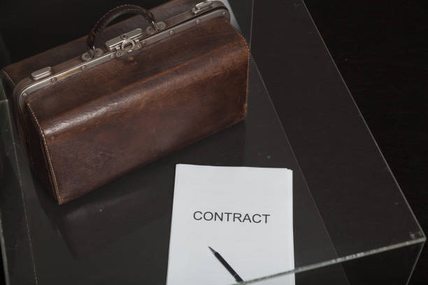 istock Contract and leather carpetbag close-up 1194137733