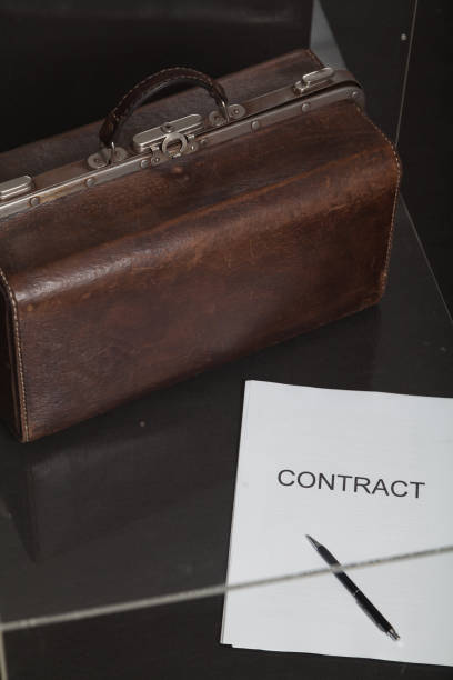 istock Contract and leather carpetbag close-up 1194137749