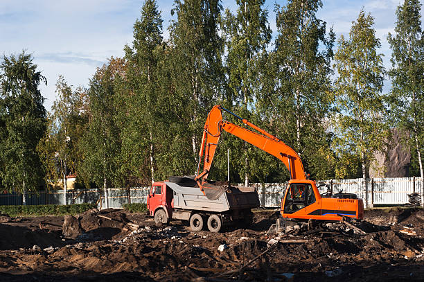 istock Excavator and dump truck 119413806